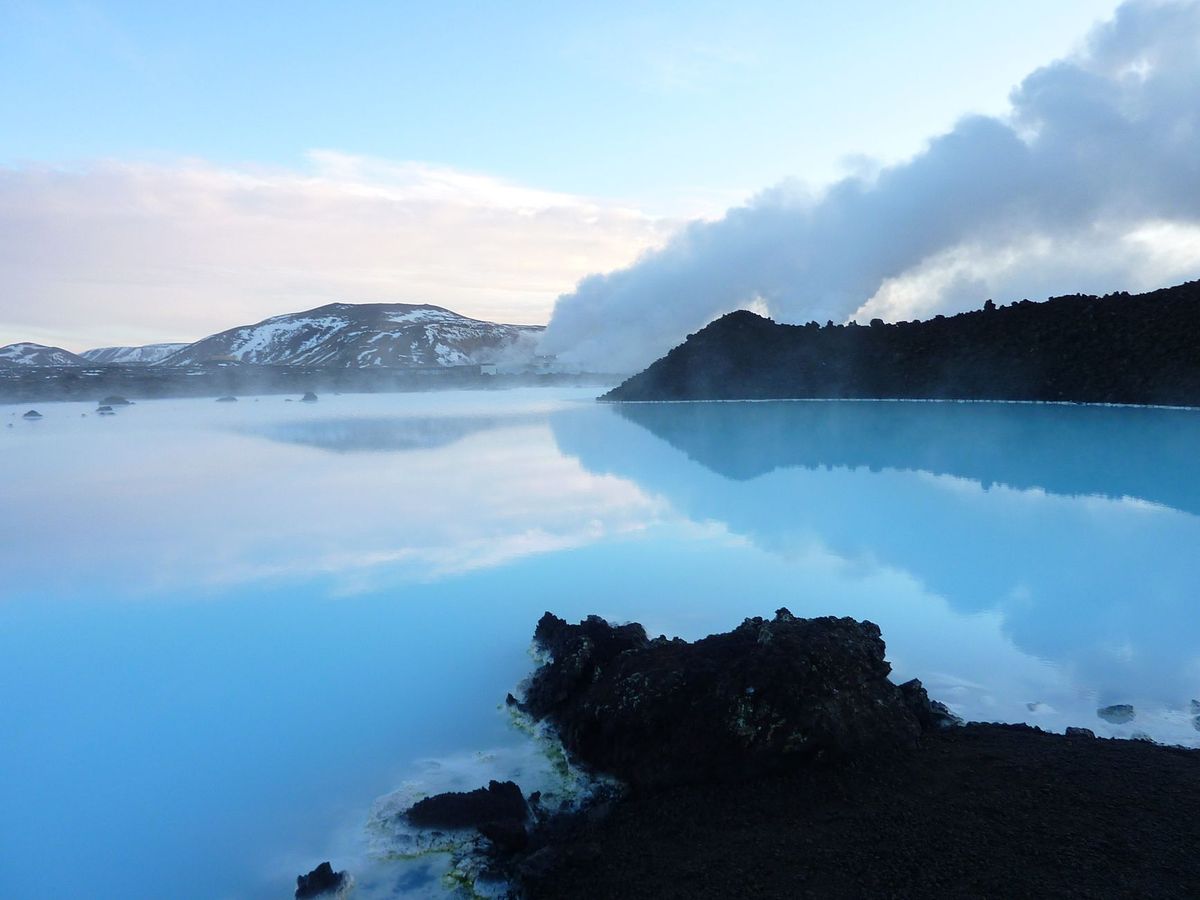 Steam drifting across the Blue Lagoon at dusk