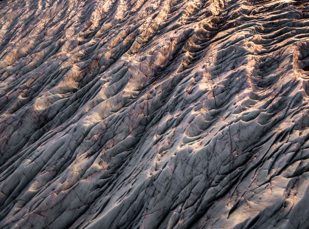 Glacier ridges from the air at golden hour