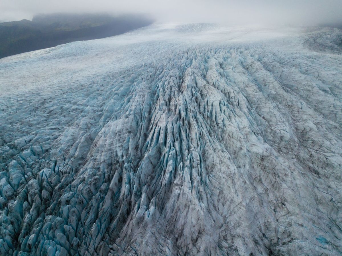 Aerial view over a sweeping Icelandic glacier