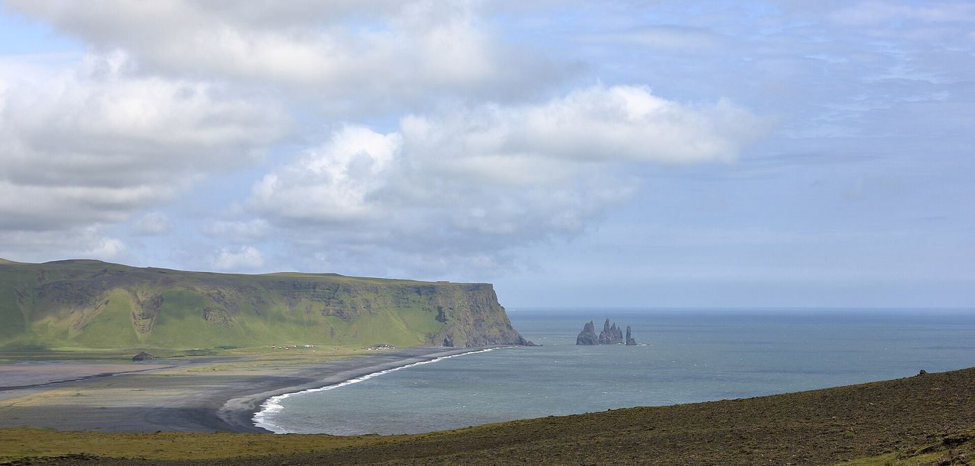 Reynisfjara's black sand beach with the Reynisdrangar sea stacks beyond