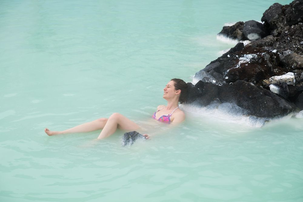 Floating in milky geothermal water